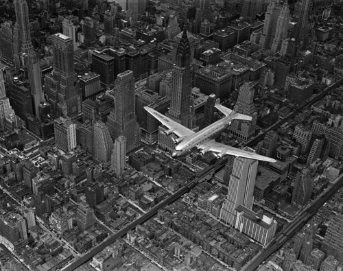 "DC-4 Flying over Midtown Manhattan" - New York City, 1939. Photo by Margaret Bourke-White